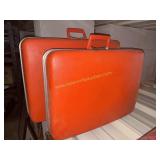 Set of vintage orange luggage