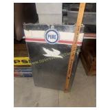 Gas pump cover makes a cool wall hanger for man