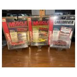 Group of three muscle cars in original packaging