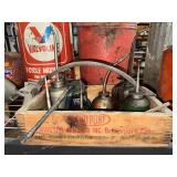 Collection of oil cans in wooden DuPont tray