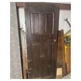 Dark Wood Paneled Door with Hardware