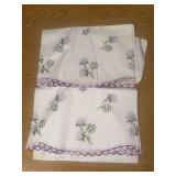 Embroidered pillowcase set with purple floral design
