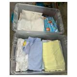 Two Plastic Bins with Assorted Linens