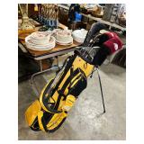TaylorMade Yellow Golf Bag with Clubs and Headcovers