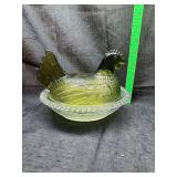 Hen on nest with green lid and clear base