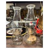 2 clear oil lamps
