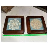 Pair of doilies in square wooden frames