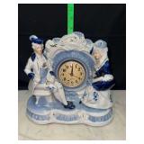 Vintage porcelain Victorian lady and gent mantle clock blue and white