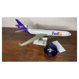 Plastic fedex plane and cobalt paper weight