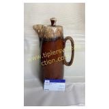Tall brown drip pottery pitcher
