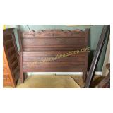 Carved bed with rails