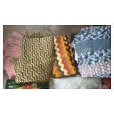 Row of afghans and blankets