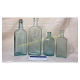 4 blue medicine bottles