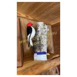 Carved woodpecker on birch