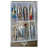 Group of 9 lures in clear box all but 3 are like