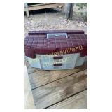 Burgundy and grey tackle box of bobbers