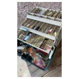 Green and tan tackle box with over 30 lures