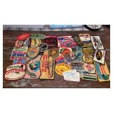 Collection of vintage fishing patches and stamps