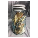 Blue mason jar with sewing items