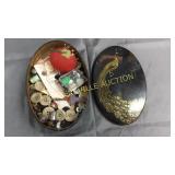 Peacock tin with buttons