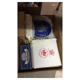 Box of collector plates and dominoes