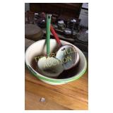 Green and red band graniteware bowl and ladles
