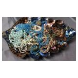 Costume jewelry in leaf bowl