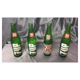 4 old 7up bottles