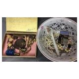 Group of finials and jewelry and glass hatchet