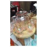 Pink depression pitcher with 5 stems