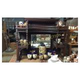 Mahogany etagere top stick and ball carving and