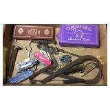Box of vintage cigarette, bottle openers, knives,