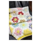 Hand stitched flower pattern quilt worn but very