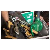 Tote of hand saws, tripod and leaf blower