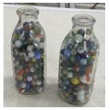 2 - Quart Milk Bottles full of Marbles