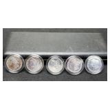 (5) Morgan Dollars In A Display Case: