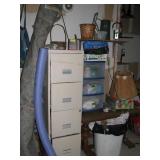 MIsc contents of garage wall, file cabinet