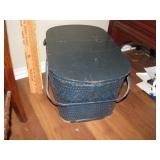 Blue picnic basket with misc yard sticks