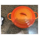 Orange cast iron pan w/lid
