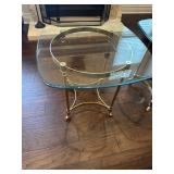 Glasstop brass leg table