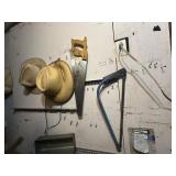 Misc hats and contents of garage wall