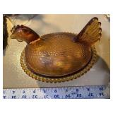 Amber glass Hen on a nest