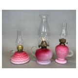 Three Cranberry Satin Glass Oil Lamps