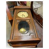 German regulator wall clock with key