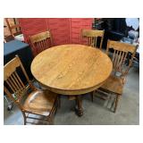Vintage oak table was four chairs and two leaves