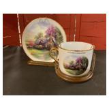 Thomas Kincaid cup, and saucer display
