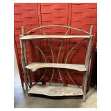 Three tier shelf made of tree limbs