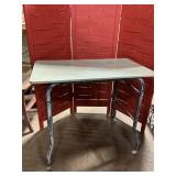 Vintage metal table on wheels