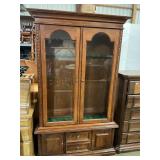 Gun cabinet holds 10 long guns with bottom storage