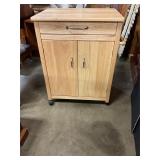 Oak cabinet on rollers